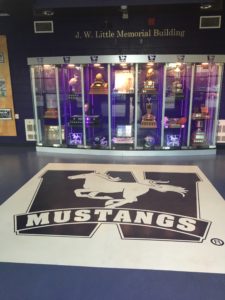 Commercial Flooring Renovation at Western University in London, Ontario using carpet tile spelling out the "Mustangs" Logo